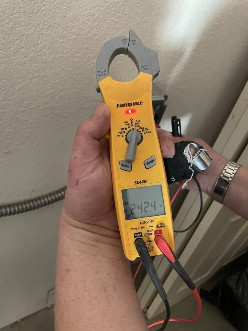 Voltage testing with clamp meter during Electrical Installation Services in Lincoln